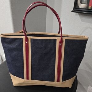 Estee Lauder Stylish Denim and Tan Tote Bag with Red Accents